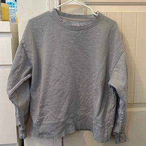 A light blue aritzia crewneck!